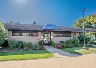 river drive apartment community building, front door leasing office zoom out