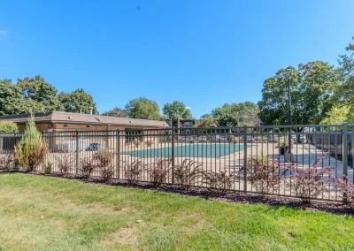 river drive apartment community building, pool area