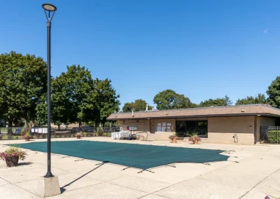 river drive apartment community building, pool, covered and closed for season